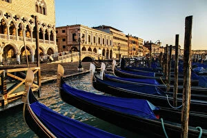 Dawn Gallery: Sunrise view on gondola station near Piazza San Marco with Palazzo Ducale (Doges Palace)