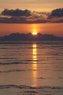 Images Dated 10th April 2012: Sunset behind the mountains of the Isfjorden with reflections in the tidal flats, Longyearbyen