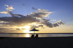 Bank Prints: Sunset on the public beach of Flic en Flac on the western coast of Mauritius, Africa