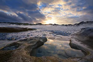 Images Dated 11th December 2014: Sunset reflection in a water puddle - Arniston, South Africa