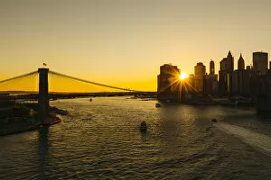 East River Collection: Sunset seen through Manhattan skyline, New York City, USA