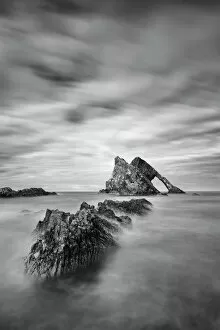 Blurred Gallery: Sunset with smooth water at bow fiddle rock near Portknockie - Scotland Europe