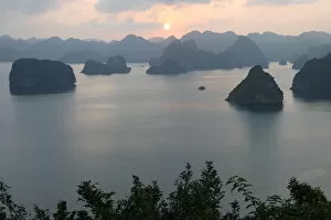 Sunset in the UNESCO-declared world natural heritage Halong Bay Viet Nam