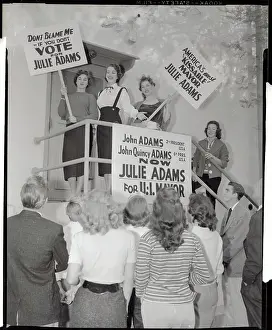 Supporters Holding Signs Calling for Julie Adam's Election