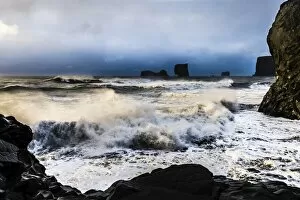 Stormy Gallery: Surf, with dramatic cloudy sky, Vik, Iceland