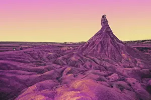 Prints of Bardenas Reales. Spain Viva Magenta Prints: Surreal colorful desert landscape with sunset gradient sky
