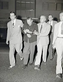 Suspect Harry Fleischer Being taken into Custody