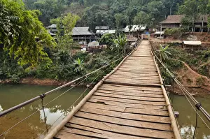 Leading Prints: Suspension bridge leading to a village, Mai Chau valley, Northern Vietnam, Vietnam, Asia