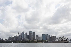 Images Dated 31st March 2014: Sydney opera house and skyline against cloudy sky, Australia