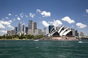 Place Of Interest Gallery: Sydney Opera House in Sydney Harbor with downtown skyline, Sydney, New South Wales, Australia