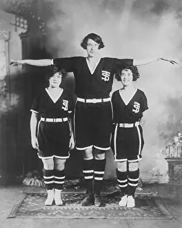 Prints of (Original Caption). York, Pa.: Tallest Women In Basketball Hoops Through Time: A Visual Journey of Basketball History: Very Tall Female Basketball Star Posing with Her Peers