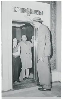 Overwhelming Prints: Tallest Man Entering Elevator