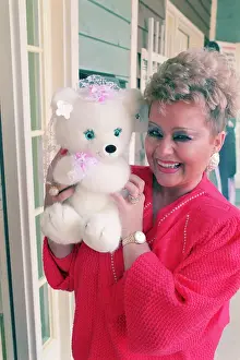 Tammy Bakker Holding Stuffed Bear