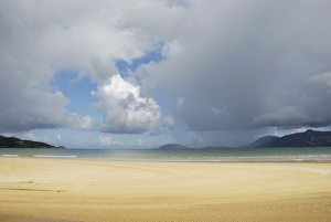 Stormy Gallery: Tannic river flowing into a churning sea under storm clouds, beach at Porta Salon, County Donegal