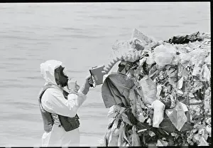 Key West Prints: Task Force Member Inspecting Pile of Garbage on Barge
