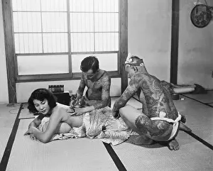 Tattoo Artist Applying Their Skills
