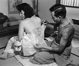 Tattoo Artist with Customer