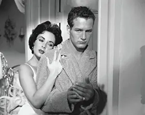 Prints of View of actors Elizabeth Taylor (1932 - 2011) and Paul Newman (1925 - 2008) in a scene from the film Cat on a Hot Tin Roof (directed by Richard Brooks), 1958. (Photo by TPLP/Getty Images) Iconic Movie Star Prints (1920s–1970s): Taylor & Newman In Cat On A Hot Tin Roof