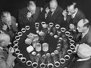 Spoon Prints: Tea Experts Seated And Testing Teas