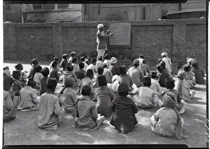 Class Prints: Teacher Instructing Class from Blackboard