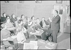 Teacher Standing in Front of Attentive Class