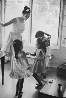 Micronesia Prints: Teacher with Three Students in Classroom
