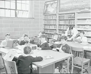 Library Prints: Teacher with Students in Library