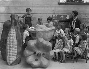 Hawthorne Prints: Teacher Using Large Food Models in Classroom