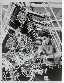 Technician Adjusting Computer Cable