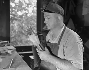 Technician Inspecting Artificial Hand