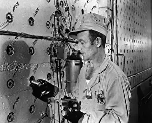 Radioactivity Prints: Technician Loading Uranium Fuel Rods into Nuclear Reactor