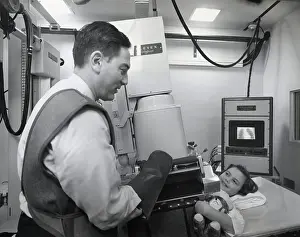 Technician Prints: Technician Setting X-Ray Up For Girl