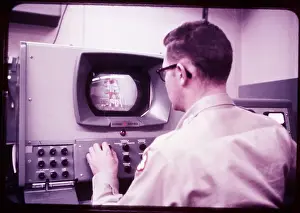 Technician Prints: Technician Watching Satellite Launch/Tv
