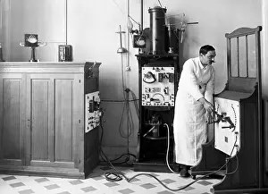 Technician Prints: Technician Working Radiology Controls