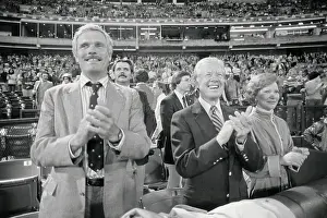 Ted Turner, Jimmy and Rosalynn Carter Cheering at Game