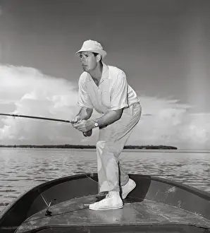 Ted Williams with Fishing Rod in Tow