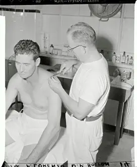 Ted Williams Having His Shoulder Treated by Trainer