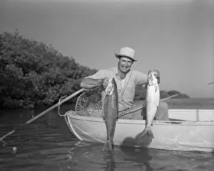 Ted Williams Holding Fish in Boat
