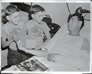 Ted Williams Lying in Hospital Bed with Young Visitors Nearby