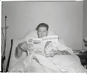 Ted Williams Reading a Magazine
