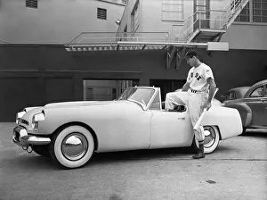 Ted Williams Prints: Ted Williams Standing by His Flajole Sports Car