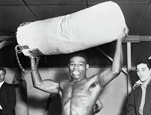 Teddy Davis Holding a Punching Bag