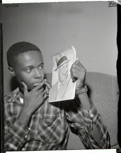 Little Rock Prints: Teenage Boy Holding Photo of President Eisenhower