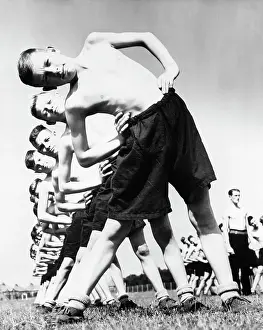 Athletic Field Prints: Teenage Boys Stretching on Field