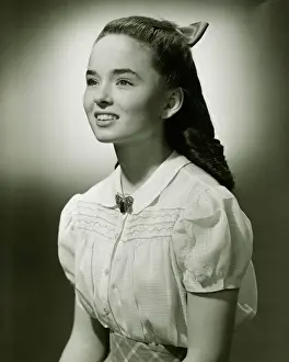 Brooch Prints: Teenage girl (14-15) with long hair, (B&W), portrait