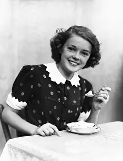 Look Prints: Teenage girl eating ice-cream, portrait