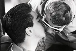 Nassau Prints: Teenage Race Driver Kisses Mother