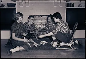 Teenagers Toast Marshmallows by Fireplace