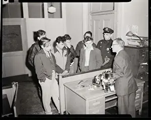 Teens, Police With Confiscated Weapons