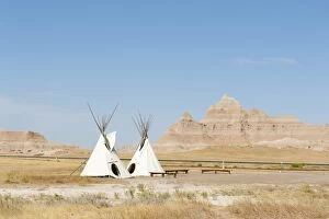 Images Dated 28th August 2012: Teepees, tents of the Oglala Lakota or Oglala Sioux subtribes, eroded landscape and grass prairie